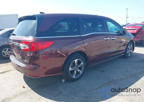 2018 Honda Odyssey Touring z USA, uszkodzony, nr VIN 5FNRL6H8XJB037572